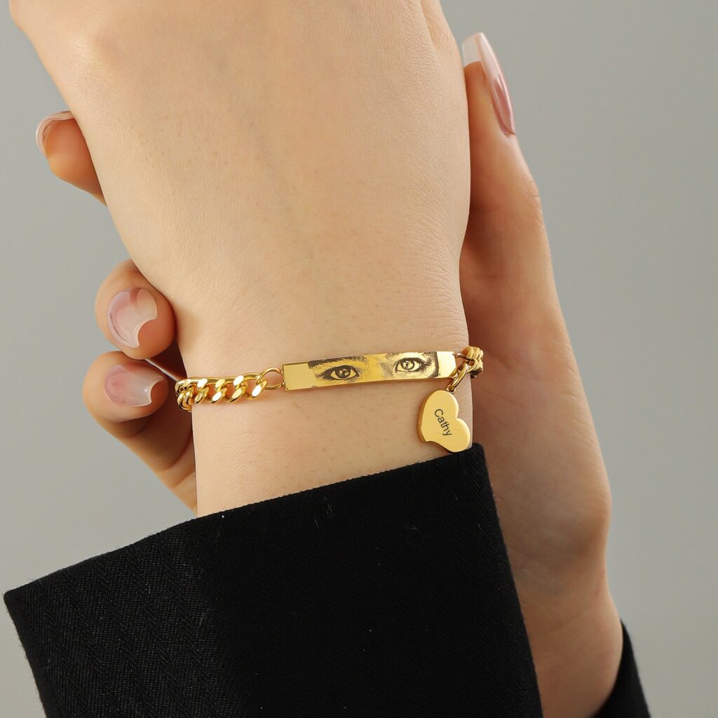 Custom waterproof gold bracelet featuring human eye motif and heart charm by JowJewelry – durable and tarnish-free.